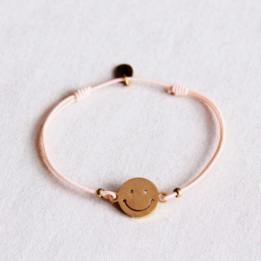 Elastisches Armband mit Smiley – Pfirsich/Gold